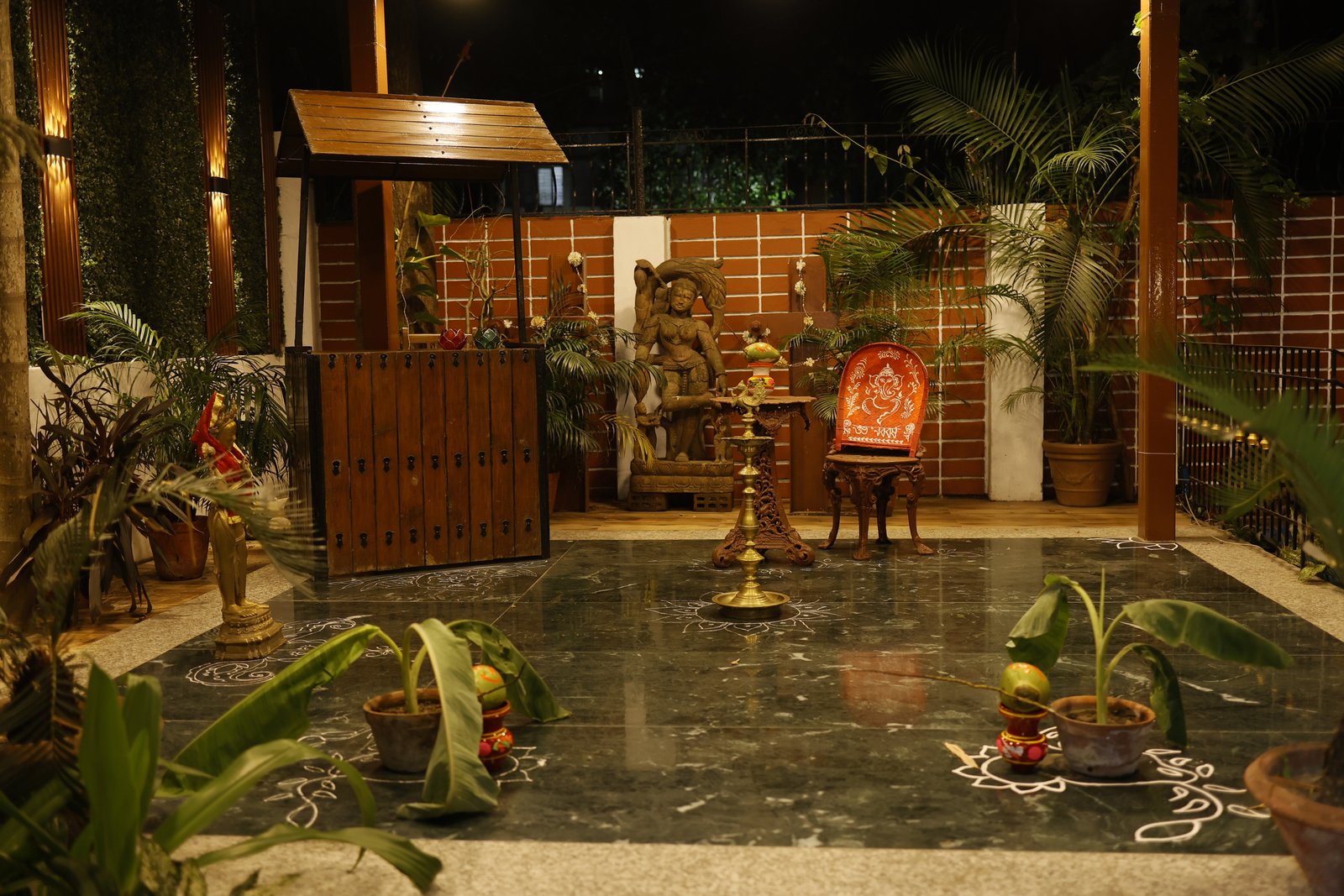 Kalpana courtyard decorated for Poila Baisakh — diya and alpana